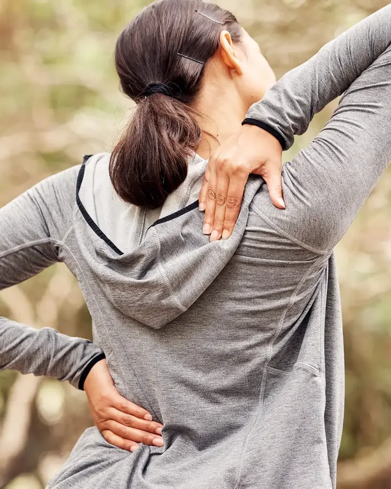 Therapist guiding a patient through hands-on spinal treatment
