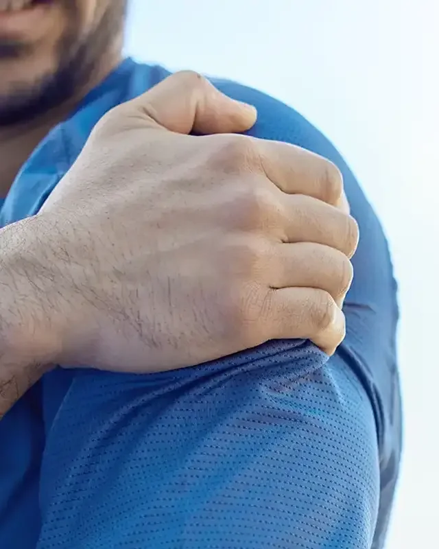 Therapist guiding rotator cuff and shoulder blade strengthening in San Antonio