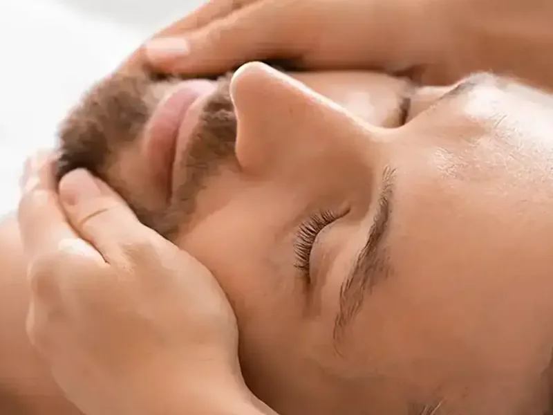 Physical therapist assessing a patient's jaw movement for TMJ and TMD