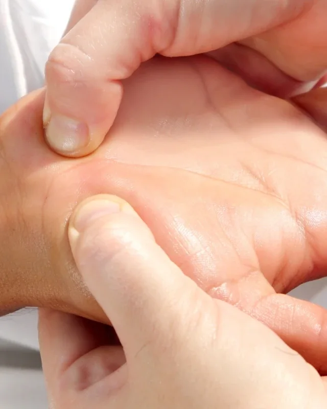 Occupational therapist treating a patient's hand and wrist at Liberty Rehabilitation Specialists in San Antonio