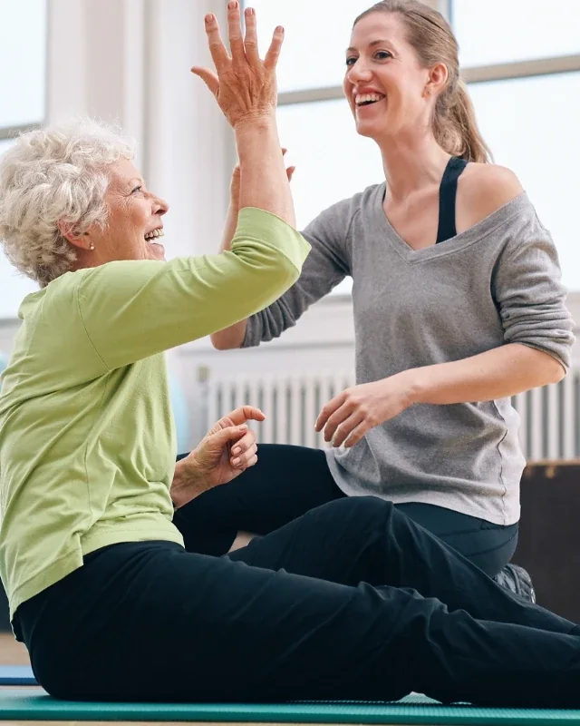 Therapist guiding a patient through large amplitude movement training