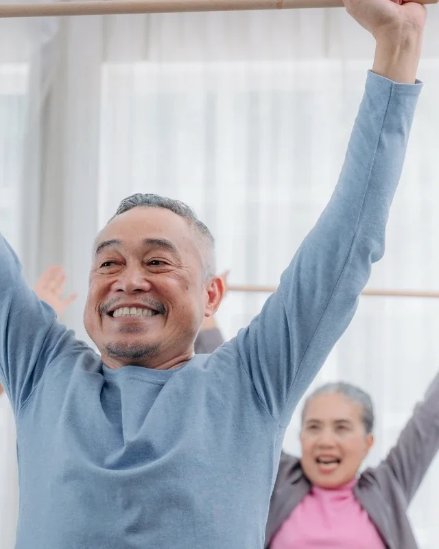 Older adults doing supervised strength and balance training with a therapist